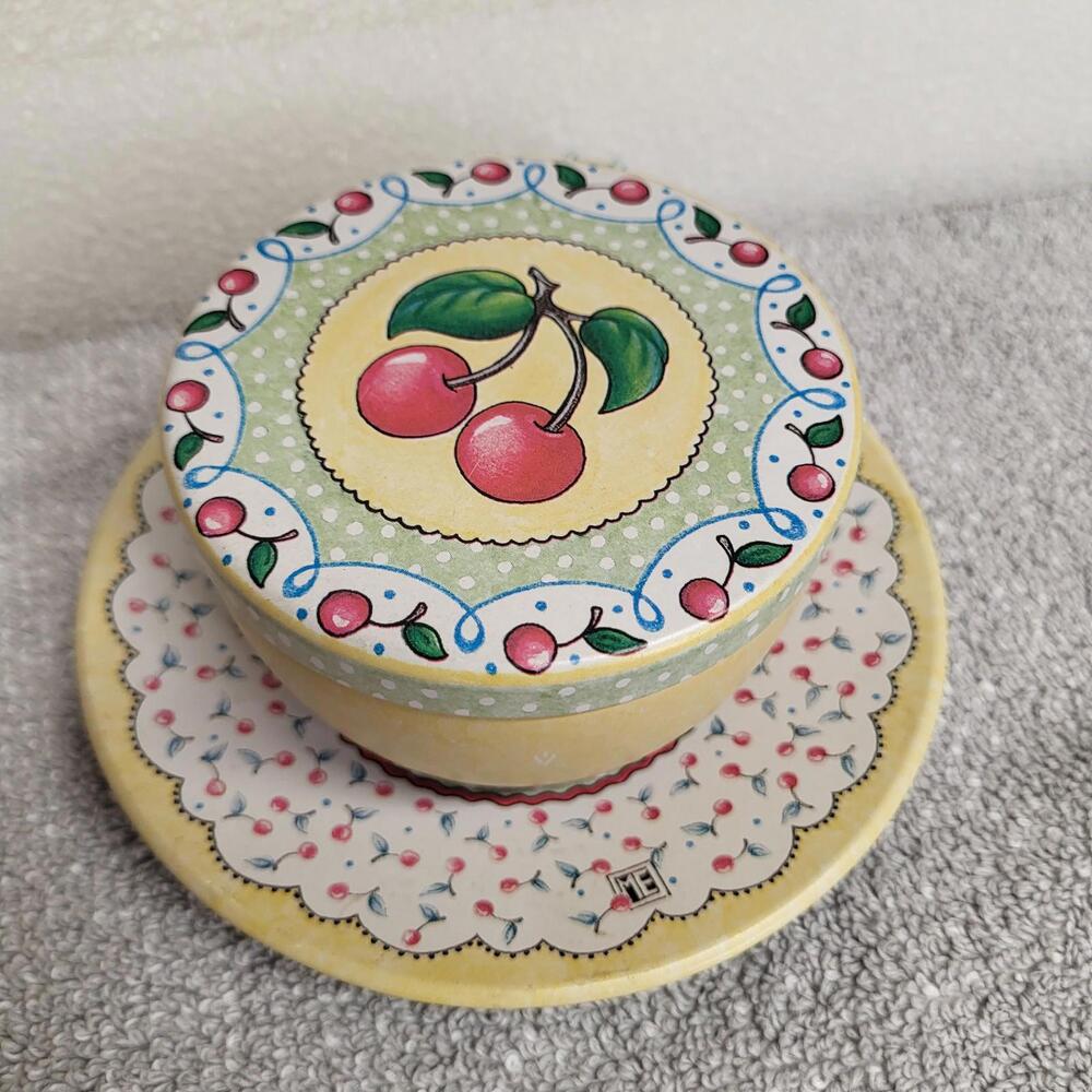 Mary Engelbreit metal/tin tea cup and saucer set featuring a cherry print design